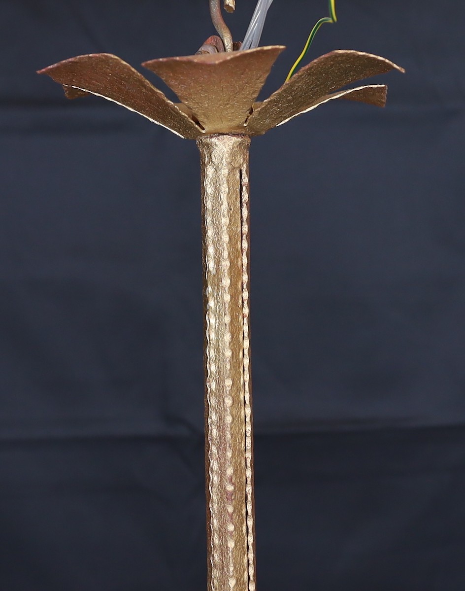 A 1920s French gold painted wrought iron light fitting with iridescent glass shades, height 62cm. width 68cm
